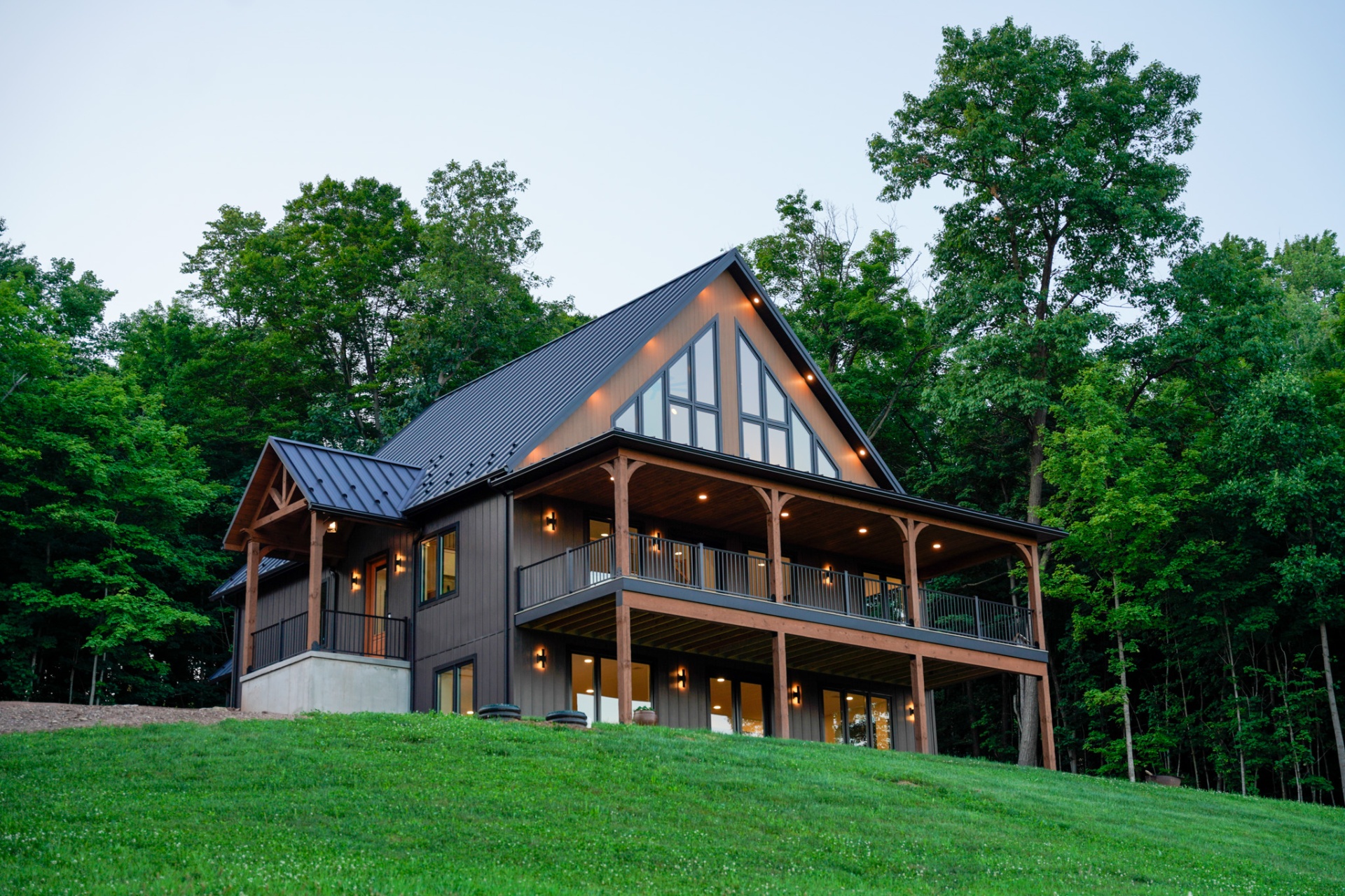The Tuscarora — modern farmhouse exterior at dusk