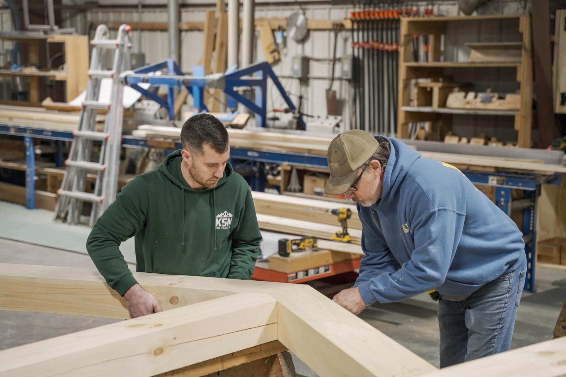 KSM Log Homes craftsmen assembling timber-frame log home in Mifflintown, PA